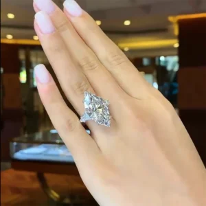 Exceptional GIA Certified 6.11 Carat Marquise Diamond Ring with tapered baguette